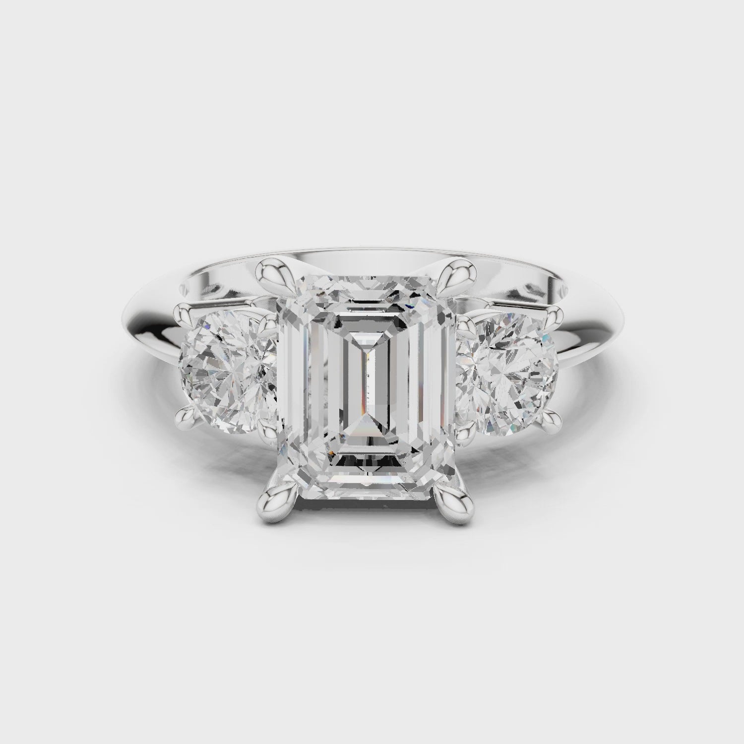 Emerald Cut Three Stone Diamond Engagement Ring with Round Side Stones