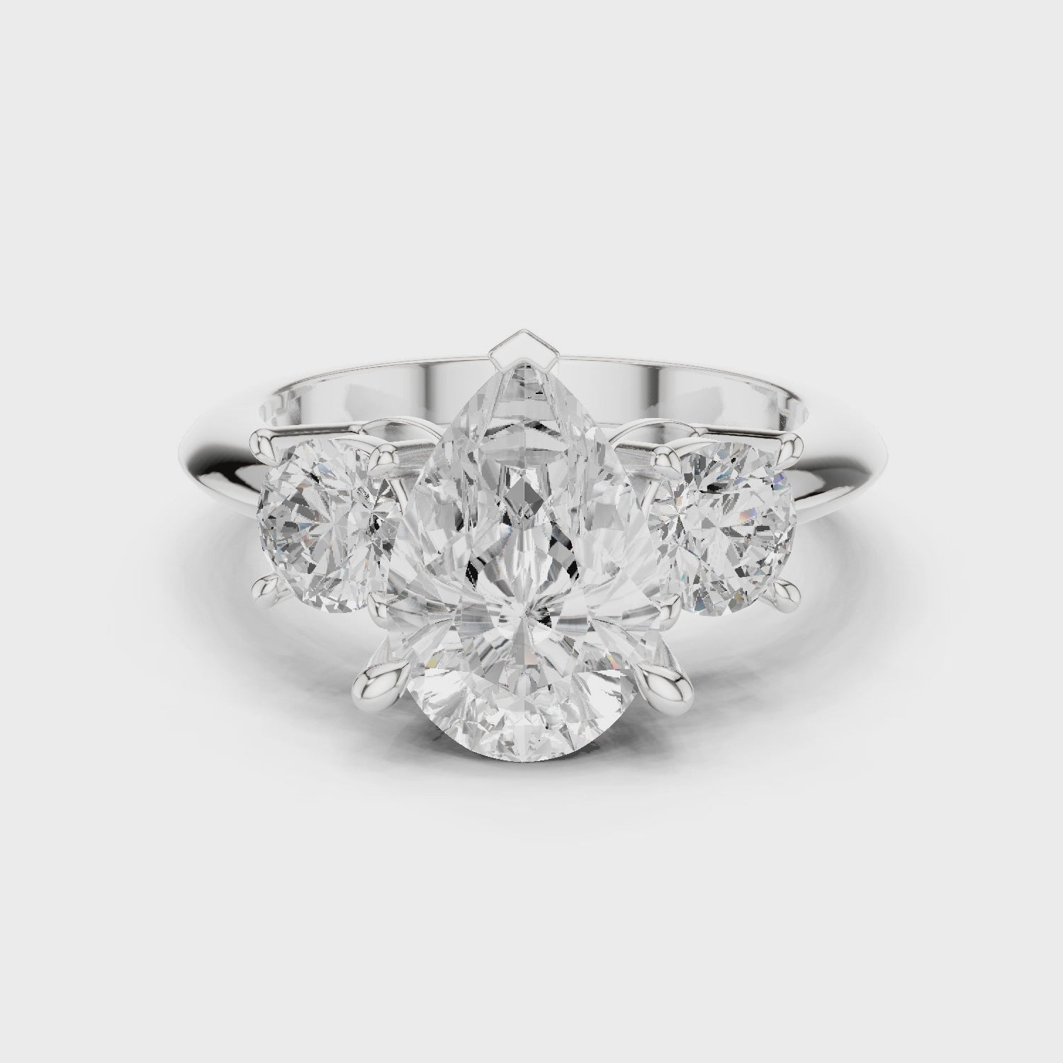 Pear Three Stone Diamond Engagement Ring with Round Side Stones
