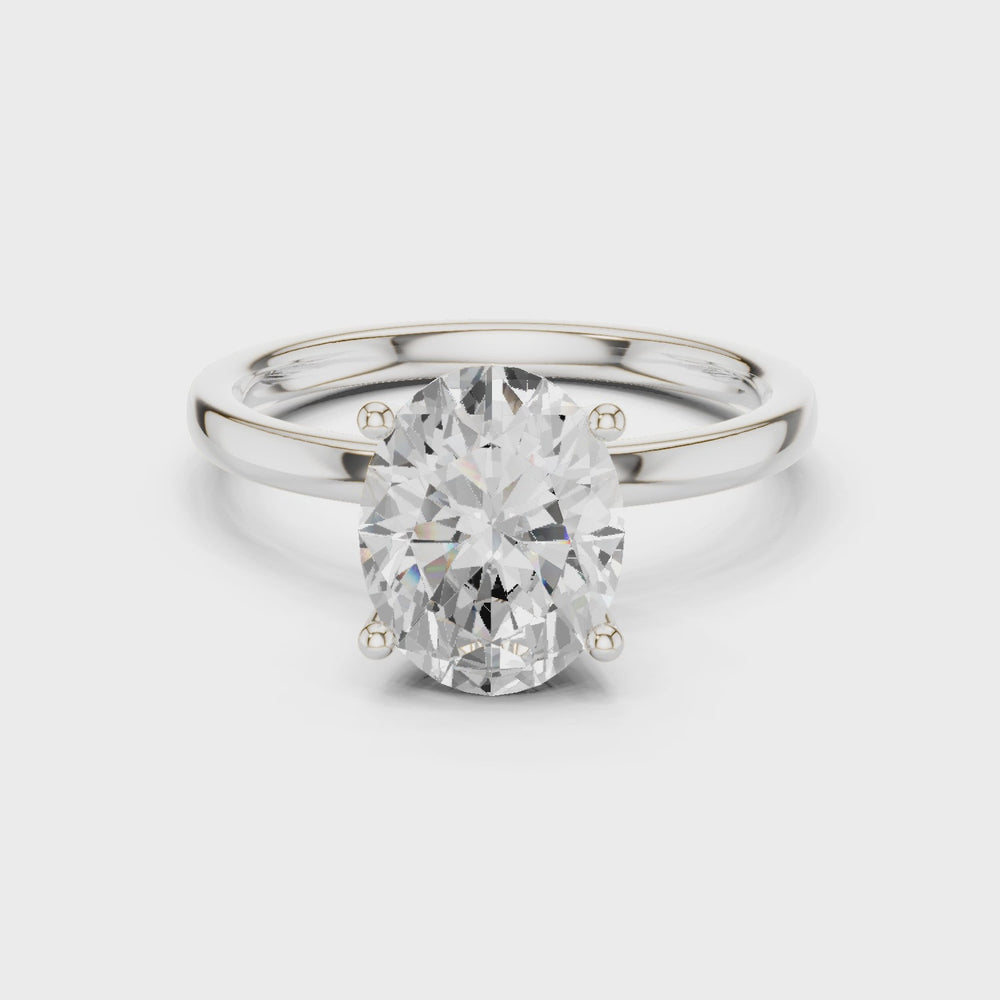 Oval Cut Solitaire Engagement Ring with Hidden Halo Basket