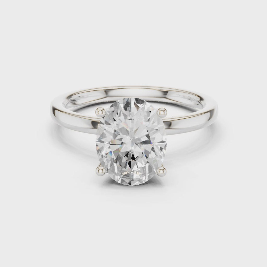 Oval Cut Solitaire Engagement Ring with Hidden Halo Basket
